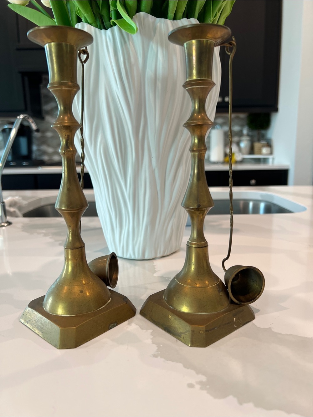 Antique brass candlestick holders pair with hanging snuffers